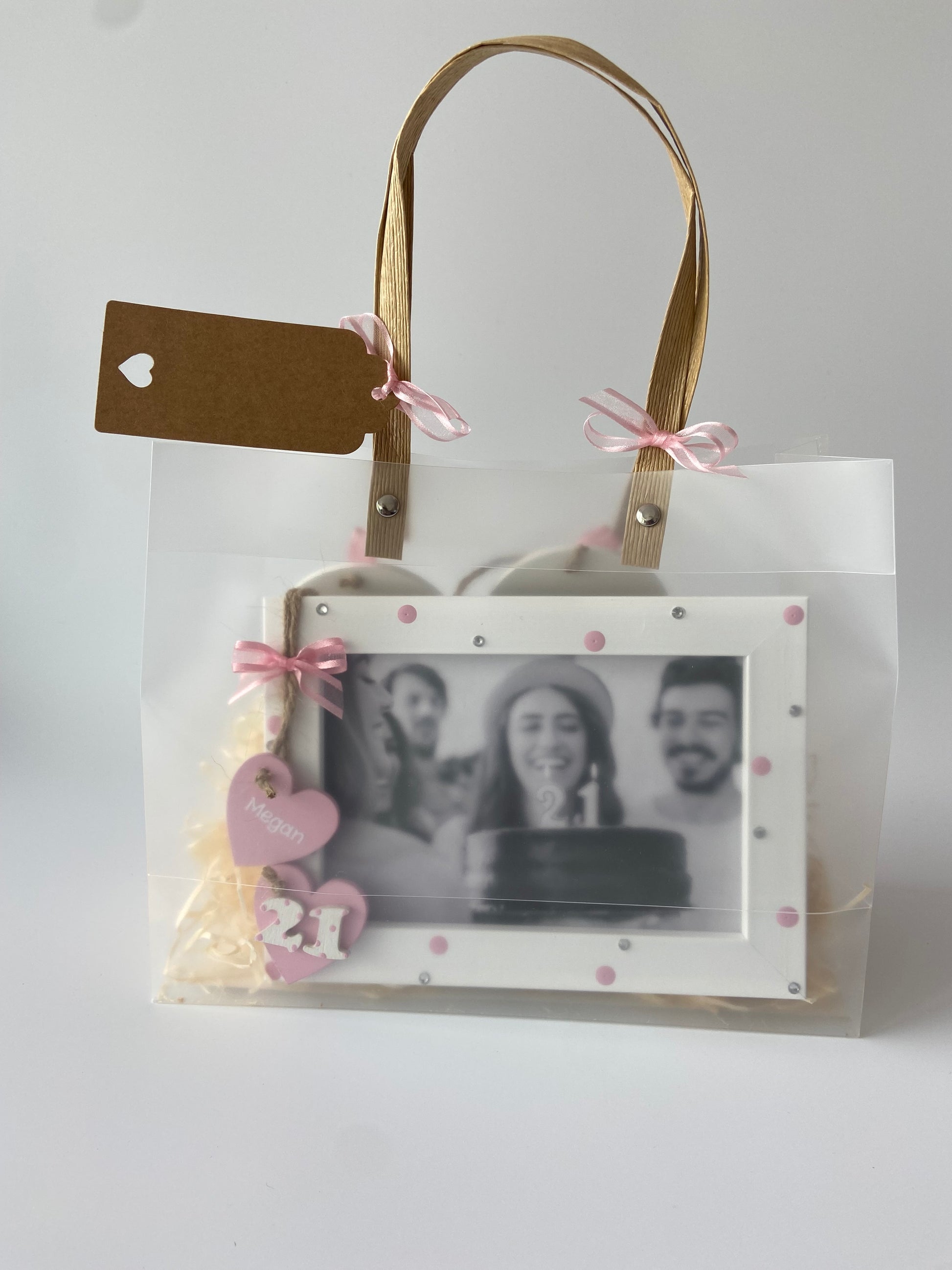 Image shows 21st photo frame included in the gift set, decorated with polka dots, gems and ribbon.