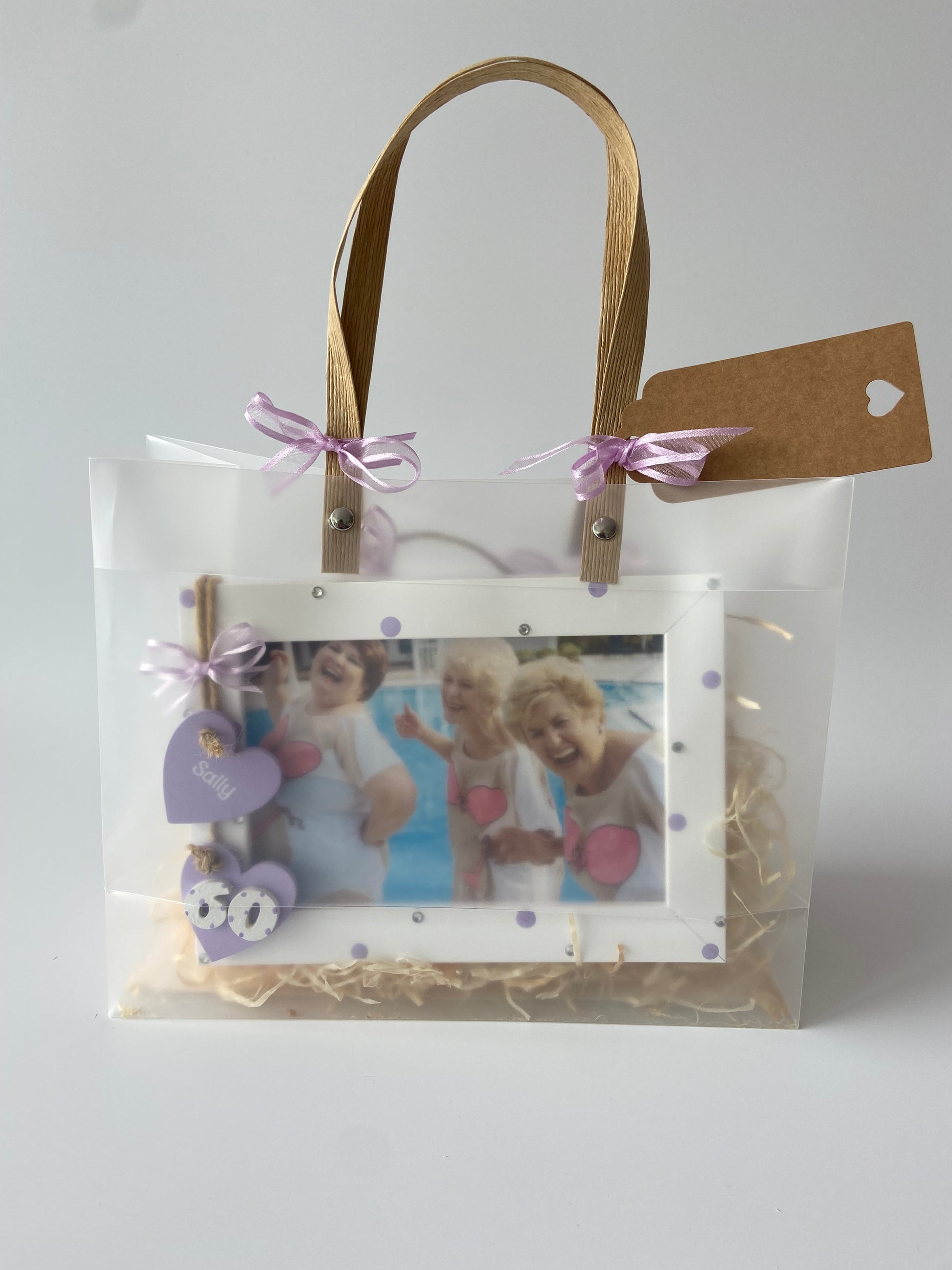 Image shows a lilac photo frame for a 60th birthday, includes gems, polka dots and ribbon