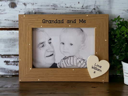 Image shows vintage grandad and me photo frame, decorated with cream polka dots and a cream wooden heart with grandchild's name.