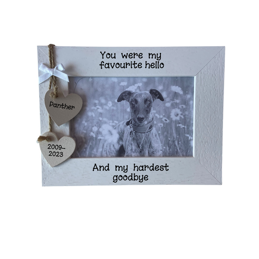 Image shows a pet loss photo frame, includes two hanging hearts with the name and years of birth and loss, also a small bow above. Can add bling if wanted.