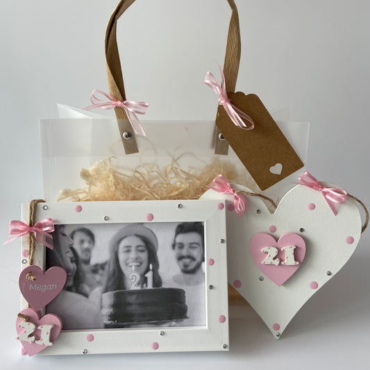 Image shows the 21st birthday photo frame and plaque included in this gift set, both decorated with polka dots, gems and ribbon. Also includes gift wrap and photo of your choice