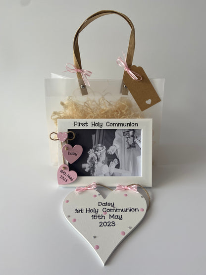 Image shows photo frame and plaque included in this gift set, plaque decorated with polka dots, gems and ribbon, frame with two hearts with name and date and a smaller heart with polka dots, included photo of your choice and gift wrap.