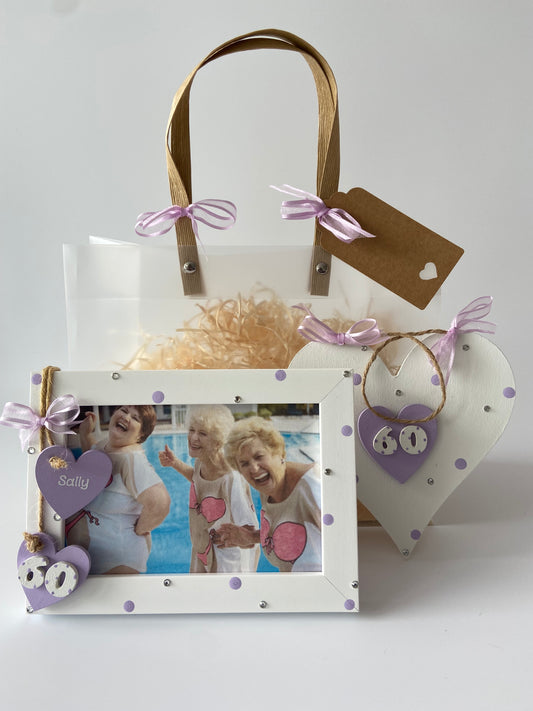 Image shows a 60th birthday gift set including a photo frame and plaque, including polka dots, gems, ribbon and gift wrap