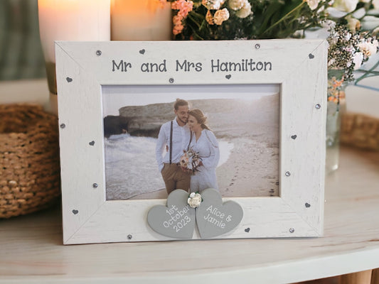 white wooden photo frame for Mr and Mrs with date and names on wooden grey hearts