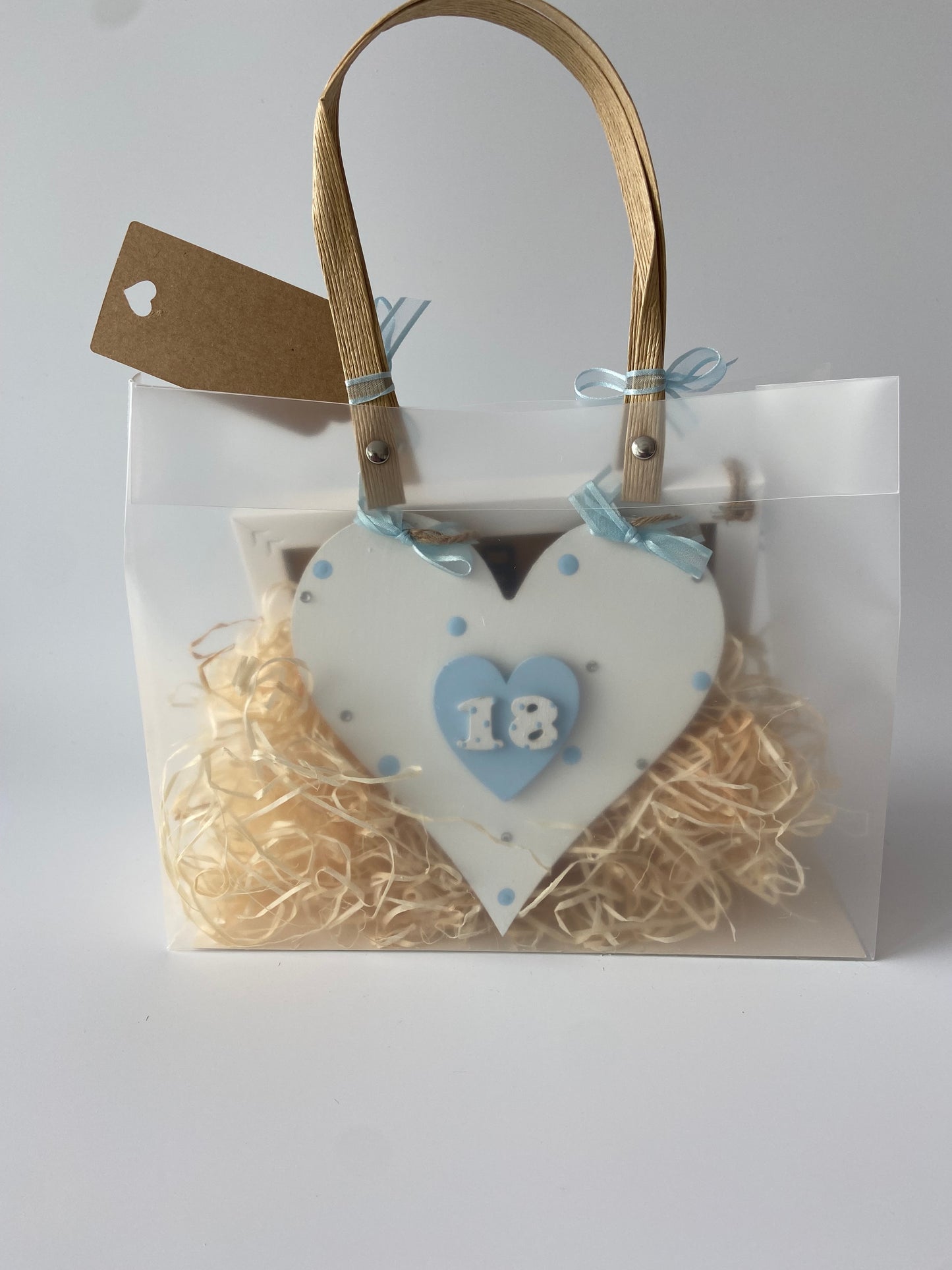 Image shows an 18th birthday plaque included in gift hamper, comes decorated with polka dots, gems and ribbon