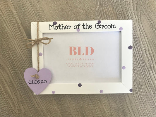 Image shows a two tone dot photo frame for mother of the groom, consists of small wooden heart for date of wedding and a string bow attached above, with two colours of your choice for dots
