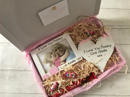 Image shows products included in pairing gift set, plaque decorated with polka dots, gems and ribbon. Photo frame decorated with baby and mummy elephant and text with child's name. Also a gift message and photo of your choice to be added.