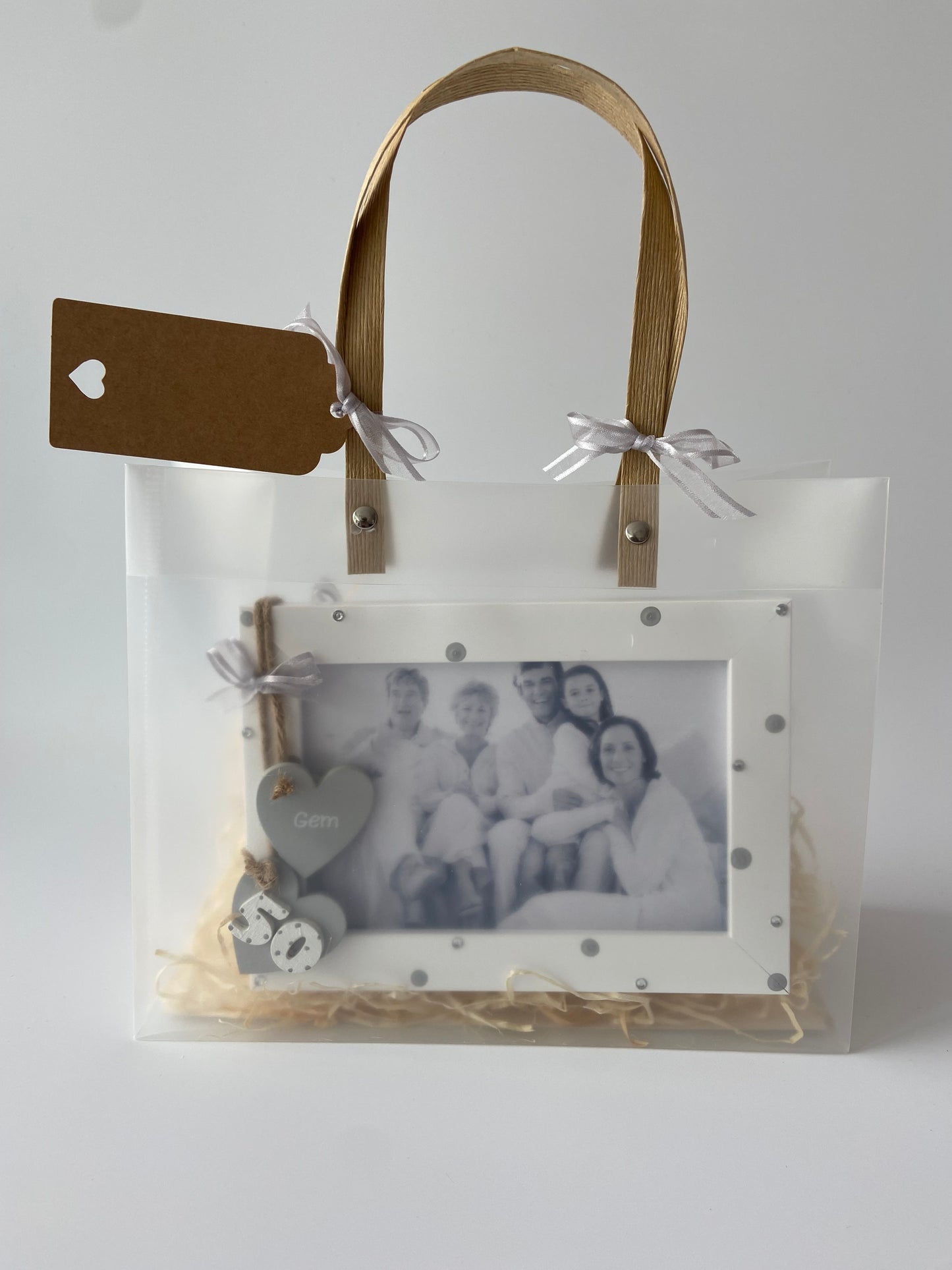 Image shows a 50th photo frame included in gift set, decorated with polka dots, gems and ribbon